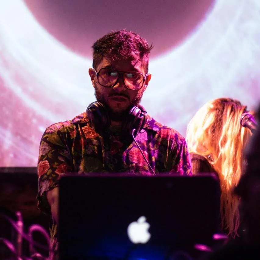 HOB in the booth in front of a projected pink moon